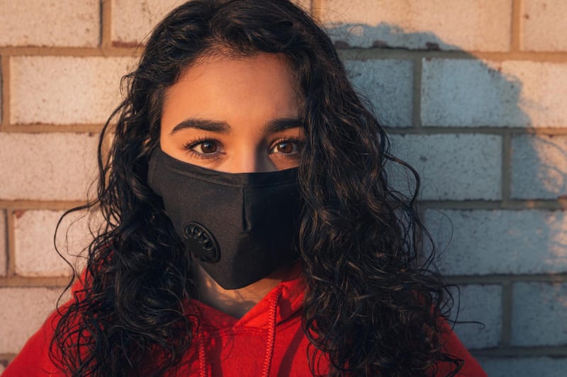 A woman wearing a face mask outdoors