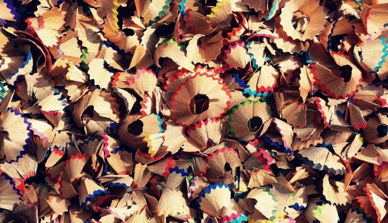 Colourful wooden pencil shavings from school and art supplies